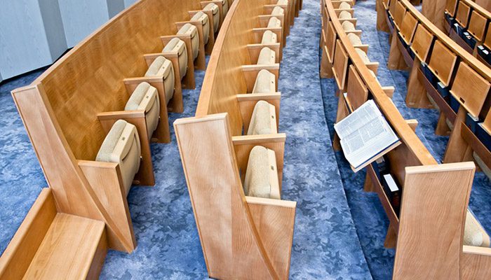 A view of a synagogue's combination seating from the side.